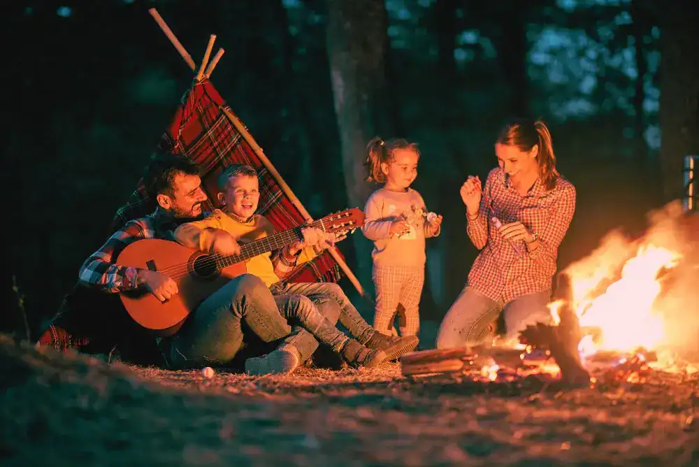 Family enjoying a campfire at a Townsend TN campground