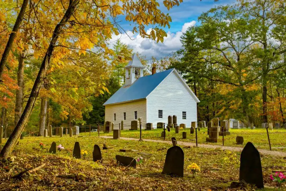 Historic white church along the Cades Cove Loop Road in the Smoky Mountains, a popular stop for visitors biking Cades Cove.”