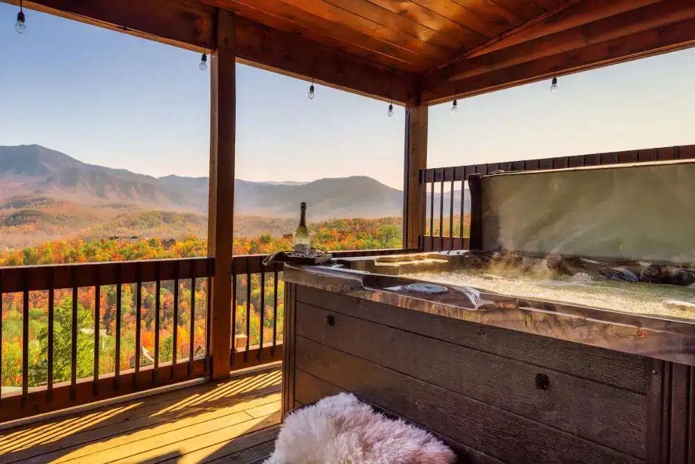 Smoky Mountain luxury Gatlinburg cabin with hot tub and mountain views, perfect for relaxing during a group getaway.