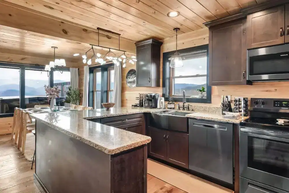 Morning Star Cabin Chalet Village kitchen with dining space, a luxury Gatlinburg cabin rental designed for group getaways.