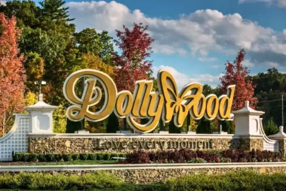 Dollywood sign surrounded by fall colors in the Smoky Mountains — part of the best family adventures in Tennessee.
