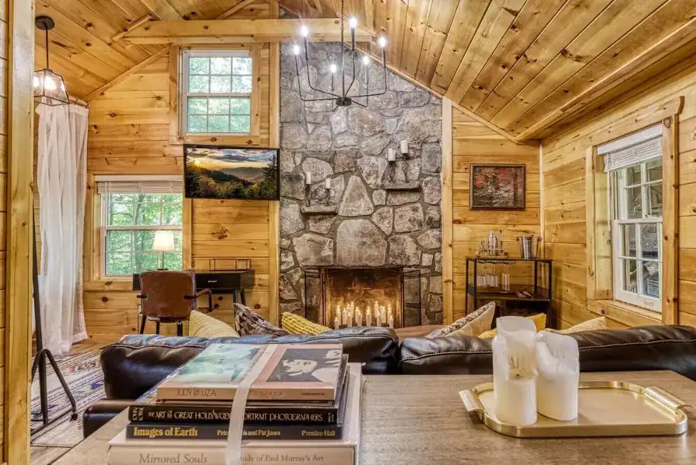 Cozy living area and fireplaace for a romantic fall Smoky Mountain getaway rental cabin in Gatlinburg. 