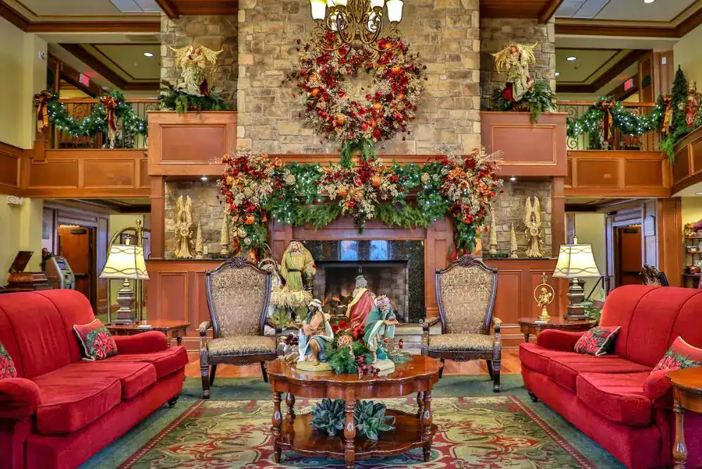 Lobby of The Inn at Christmas Place in Pigeon Forge decorated with twinkling lights, garlands and Chrismtas decor.
