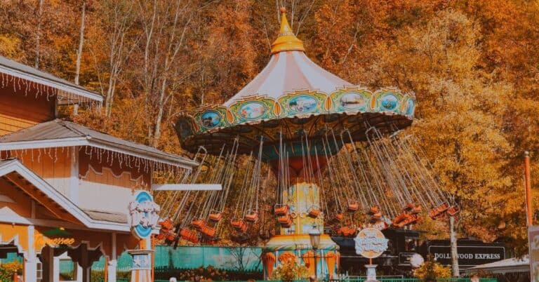 Family enjoying Dollywood swings during fall in the Smoky Mountains — colorful leaves, fun rides, and family adventure in Tennessee.