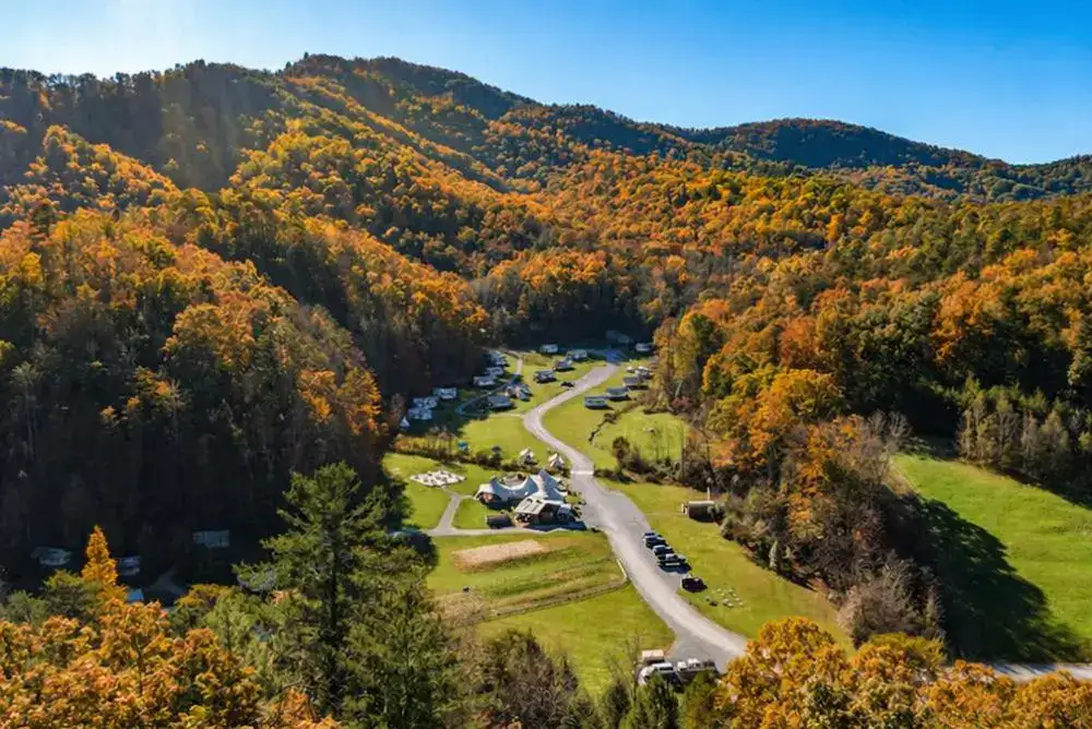 Fall glamping in the Smoky Mountains at Under Canvas, with safari tents tucked into a valley of fall color