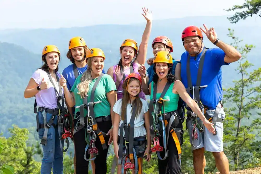 Zipline adventure through colorful fall trees in the Smoky Mountains — fun family activity for all ages.