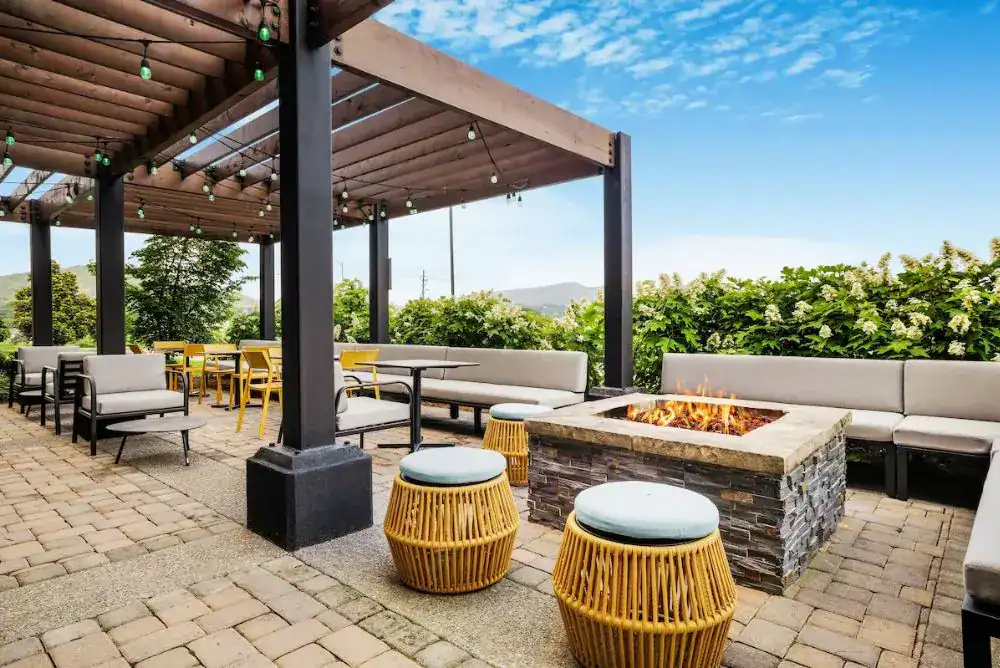 Outdoor patio with a fire pit at Home2 Suites by Hilton 