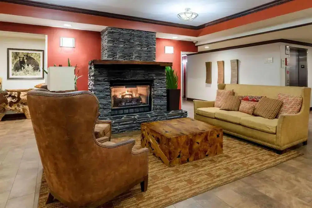 Cozy lobby with a fireplace at La Quinta Inn & Suites in Pigeon Forge.