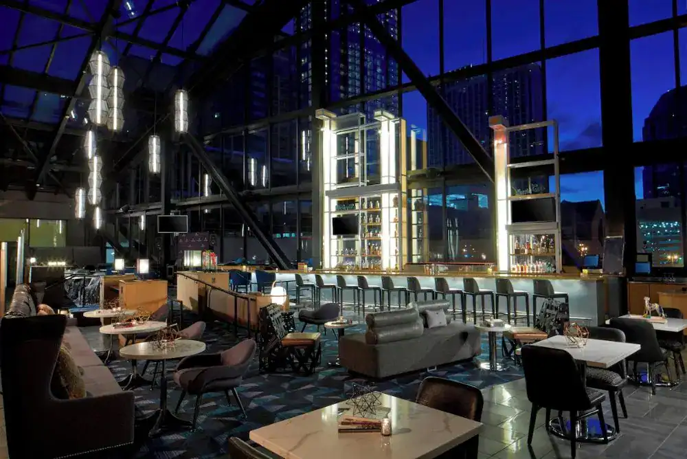 Renaissance Hotel bar area with tables and chairs 