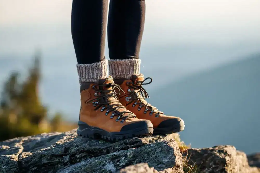 Hiker standing on a rocky overlook along Tennessee State Parks hiking trails