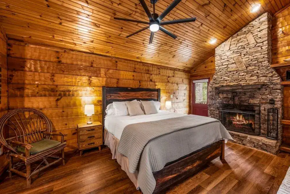 Romantic cabin for couples in Townsend TN, one of the coziest places to stay in the Smoky Mountains, with a bedroom fireplace