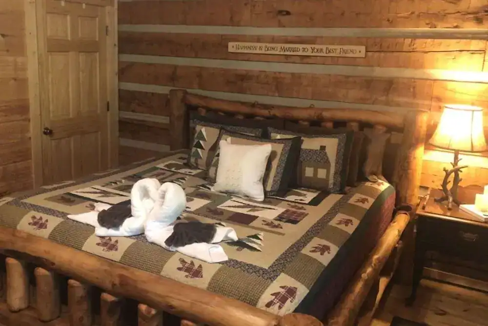 Romantic cabin bed in a Smoky Mountain cabin stay near Townsend TN