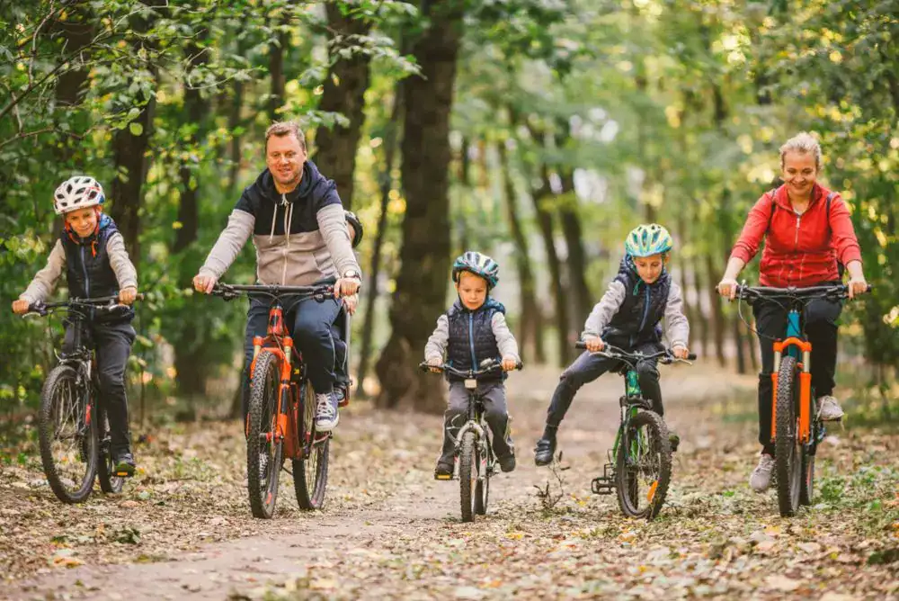 Family riding bikes during a camping trip in Townsend in the Smoky Mountains. 