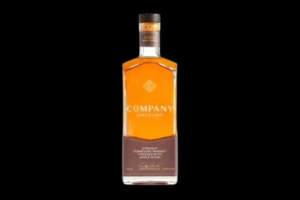 Company Distilling whiskey bottle on a black background