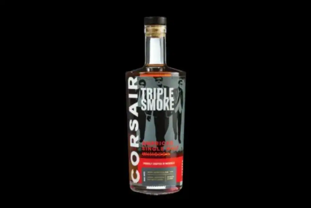 Bottle of Triple Smoke from Corsair distillery on a black background. 