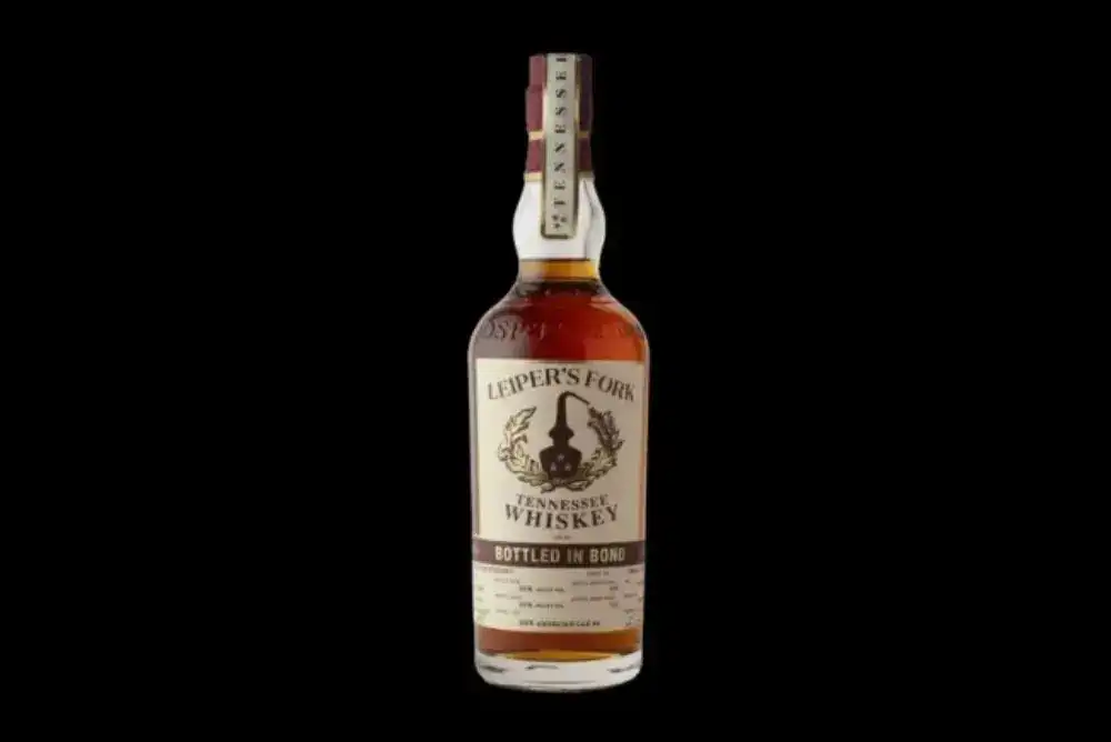 Leiper's Fork Distillery Tennessee whiskey bottle on a black background.