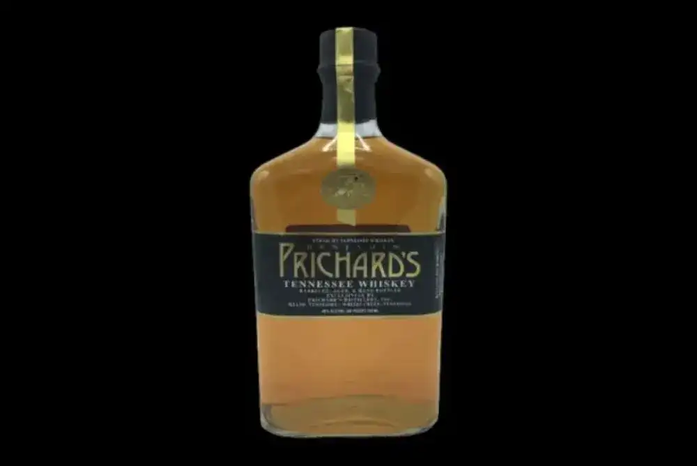 Bottle of whiskey from Prichard's Distillery on a black background.