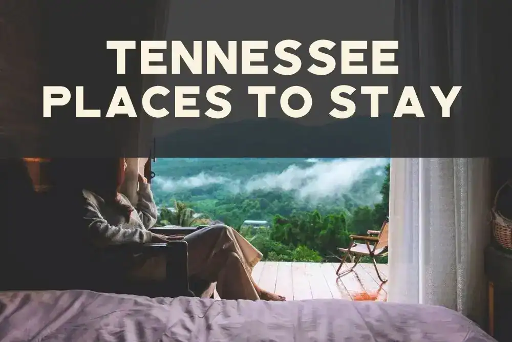 Cozy cabin bedroom with misty Smoky Mountain views outside the window - featured in our tennessee travel guide for vacation ideas and places to stay in tn. 