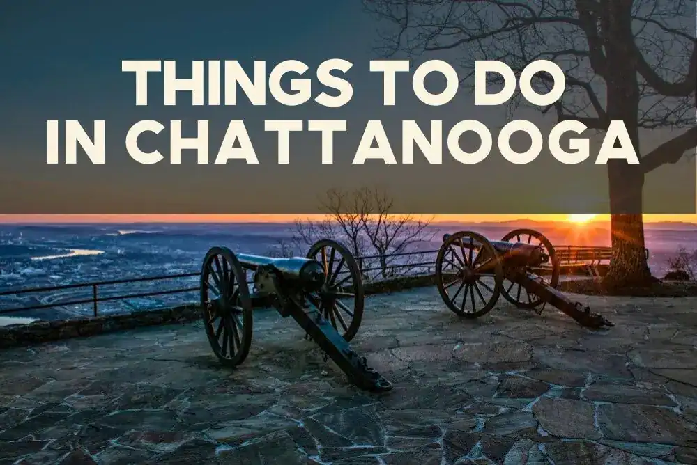 Historic cannons overlooking the Tennessee River and mountains at sunset in Chattanooga, a scenic highlight in our Tennessee travel guide.
