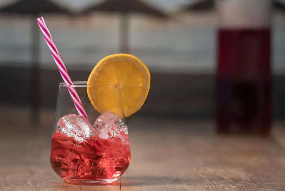 Red moonshine cocktail showcasing the creative flavors Tennessee distilleries are known for
