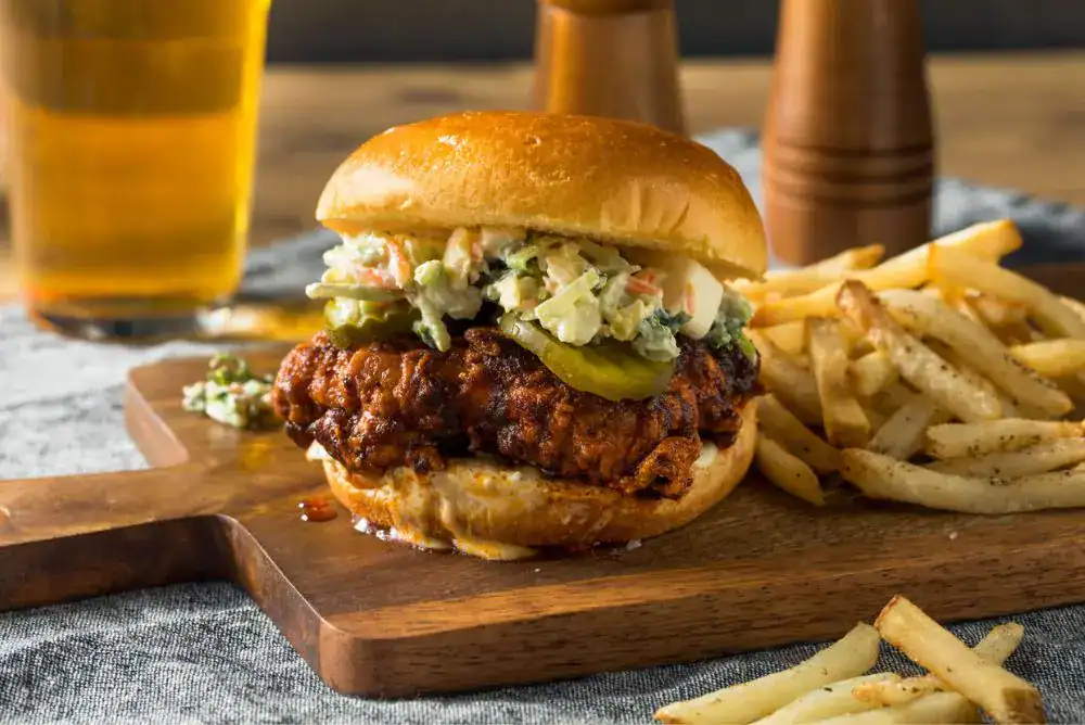 Nashville hot chicken sandwich with fries, a Tennessee food and Southern cuisine favorite