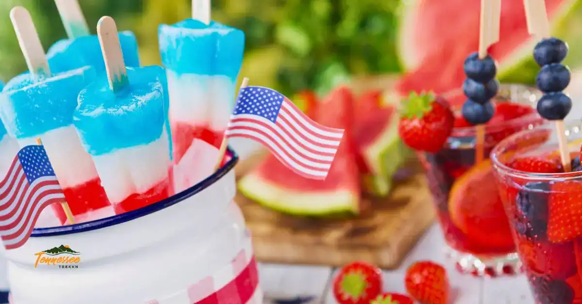 Easy July 4th drinks for kids with red, white and blue layered drinks, patriotic popsicles, fresh berries, and American flags.
