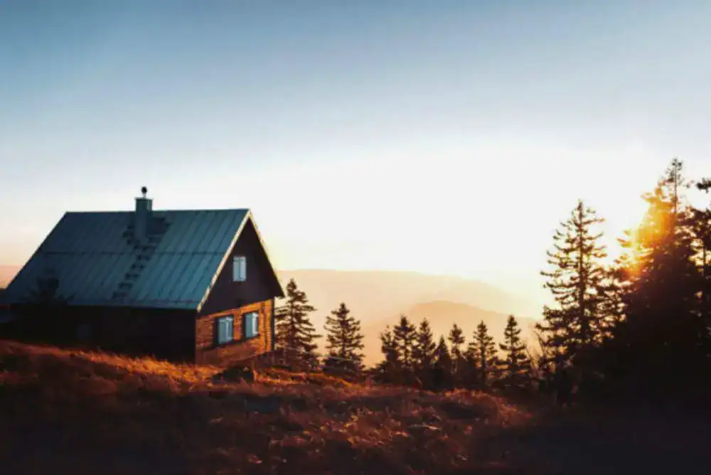 Wood cabin at sunset on a mountain hillside, one of the Tennessee cabins with a view
