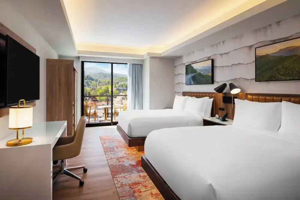 Two queen guest room with private balcony at Hotel Indigo Gatlinburg