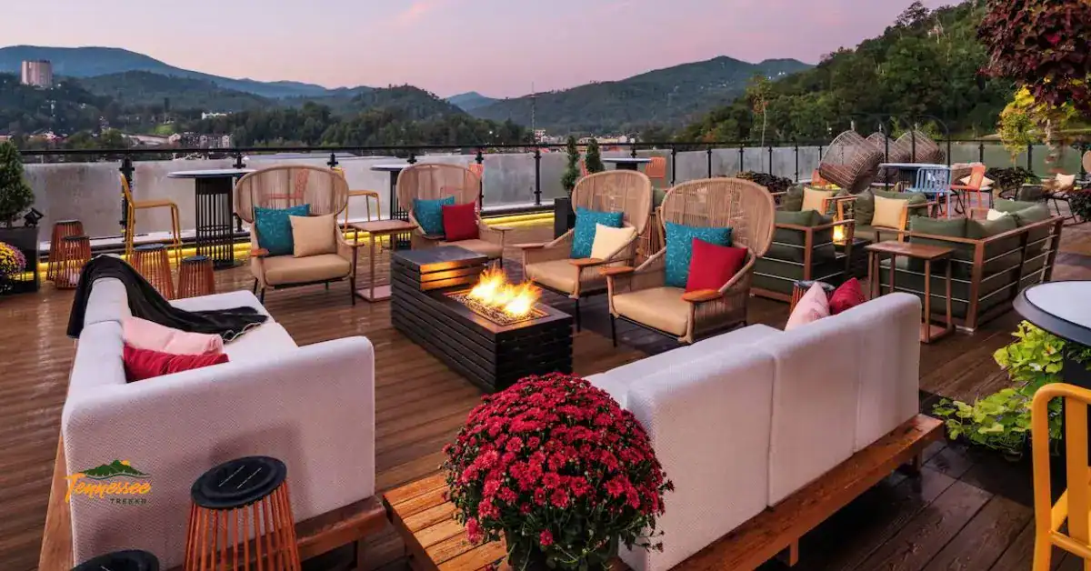 Rooftop terrace with fire pit and Smoky Mountain views at sunset at Hotel Indigo Gatlinburg