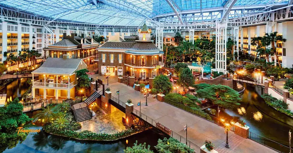 Gaylord Opryland Resort in Nashville featuring an indoor atrium with gardens, waterways, bridges, and a glass ceiling.